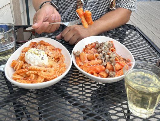 The pasta on the left is option 3 on the menu (with burrata), and the pasta on the right is option 1 on the menu.