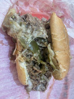 Half the cheesesteak. They said it was really good! They added jalapeños and split it