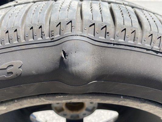 Tire bulge on the inside of the tire seen by the technician at pull in, while there for a smoke out of engine issue!