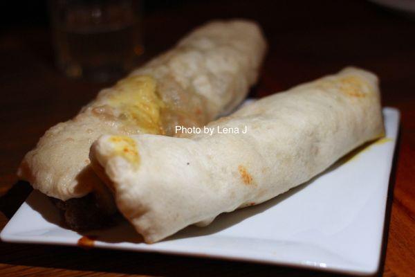 2 pieces Chola Bhatura ($6.50 per piece) - chickpea curry with tamarind mint sauce, wrapped in fried bread