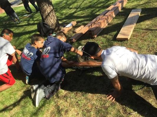 After-school teens are building picnic tables for the library. The Denver Tool Library is helping out with their tools and expertise.