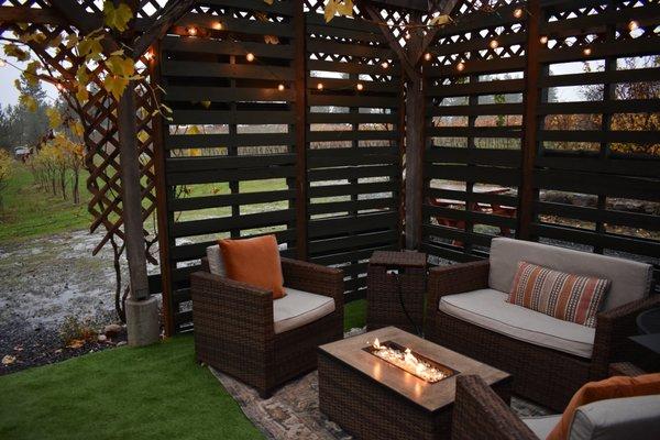 Our covered patio features comfy furniture and a fire to keep you warm while you enjoy a glass of wine.