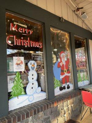 Whimsical Christmas Decorations outside, they have a few outdoor tables