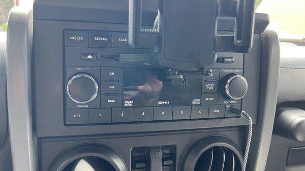 Before install, factory stereo. Had a mount for my phone, which was always in the way and falling out.