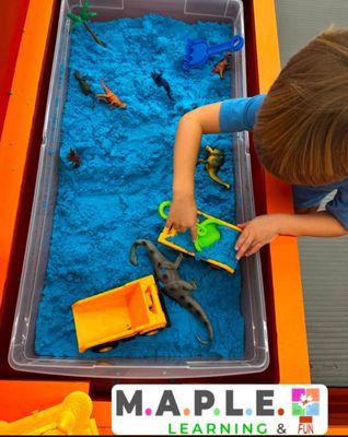 Sensory station currently filled with kinetic sand