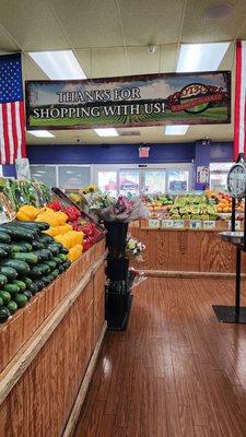 welcome sign over fresh produce