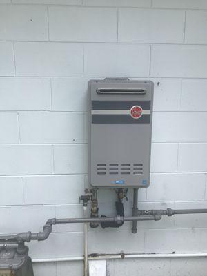 A simple outdoor Rheem gas tankless water heater.