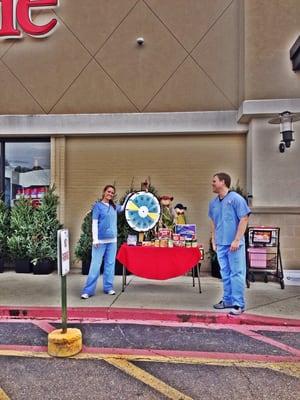 Clay and Natasha at the food drive !!! Giving back is very important to the all American staff !!!