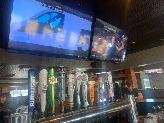 The bar and one side of the televisions to enjoy your beer!