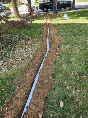 Drain lines from home to curb. Sump pump lines. Repair and replacement.