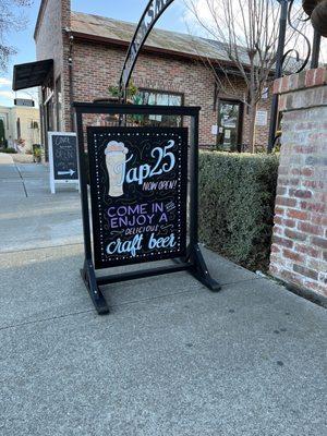 Cute sign on the sidewalk!