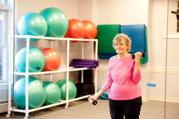 A resident working out in one of our two onsite gyms. We offer gym access, trainers, and classes to our community.