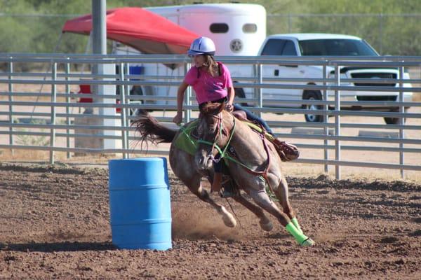 Carly and Cherry turning their first barrel at the SSC Gymkhana.