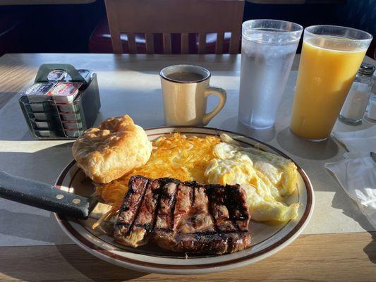 6oz ribeye and eggs medium rare. Biggest/freshest biscuit I've ever ate.