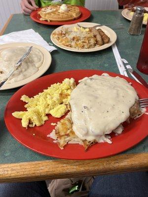 Country fried chicken. Scrambled eggs with hash browns