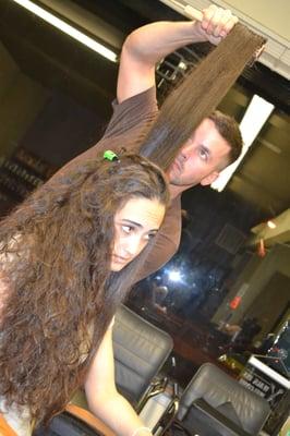 Owner Justin May in action with a fabulous blowout!