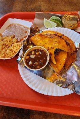 Birria Queso tacos, refried beans & rice with a Agua de Mango drink. Total $19.36 Muy Delicioso