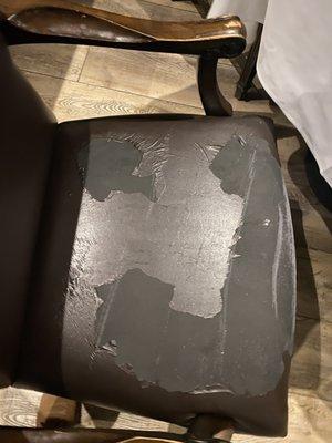 Ripped leather on all chairs.