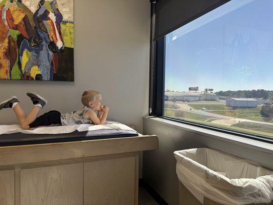 My son waiting in the doctors room! Such a calming environment for an anxious little guy.