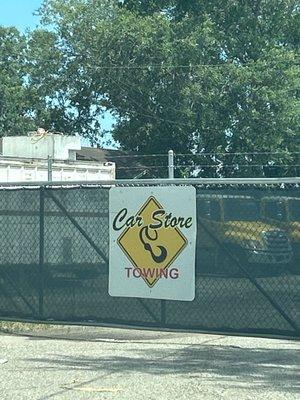 Car store towing logo