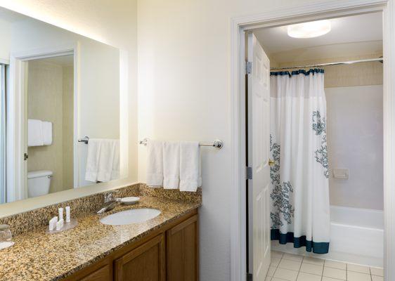 The suite bathrooms feature granite countertops, and complimentary toiletries and fresh towels will make you feel right at home.