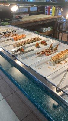 Sushi bar.   All you care to eat