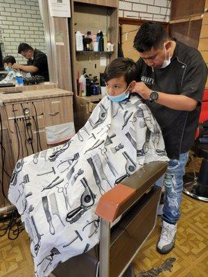 5 year old getting a cut.