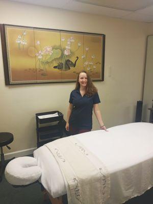 Therapist Jerrica in massage room