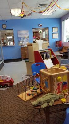 Waiting area with toys and books.