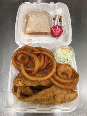 Whiting dinner accompanied by onion rings and coleslaw