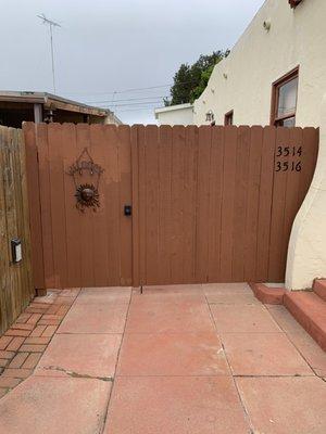 Driveway gate 1/3-2/3, walk through gate to rear units..