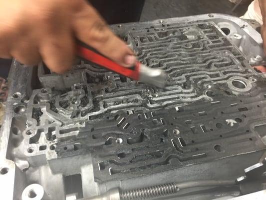 Aamco Master Rebuilder cleaning valve body corrupted by overheated transmission