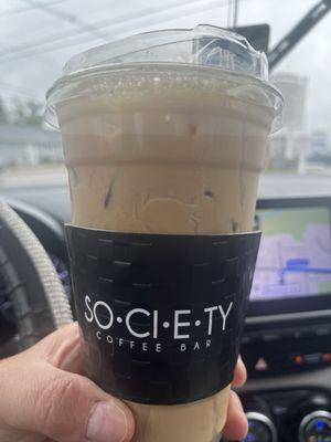 White chocolate, pistachio oat milk iced latte