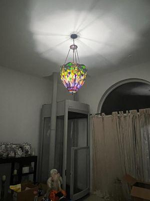 Stained glass chandelier from 1902, refurbished an hung from a  foot high cieling