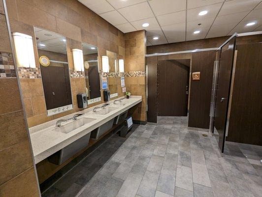 Inside the men's restroom by the dining room.