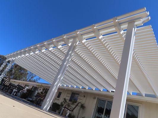 Lattice patio cover with underhung rafters.