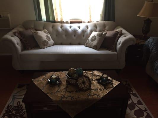 Our tufted sofa. It didn't come with those pillows though , we bought them separate