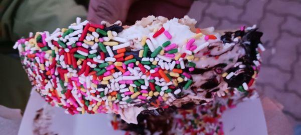 Choco Taco with cookie dough ice cream, hot fudge and sprinkles.