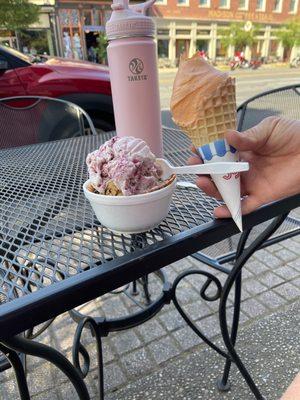 Orange sherbet and blackberry cobbler on waffle cones