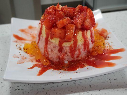 Mexican Berry- Strawberry & Mango snow drizzled w/chamoy, topped w/ strawberry chunks, tajin & mango bursting bobba on the side