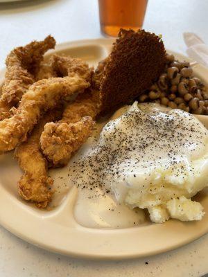 Chicken strips, mashed potatoes, black eyed peas, and cornbread.