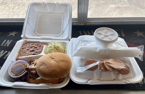 Chopped brisket sandwich baked beans and potato salad.