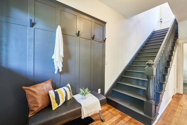 Black staircase and entryway provides endless style.