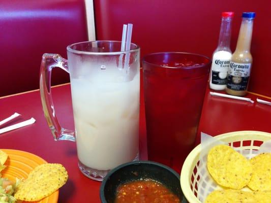 Mug of horchata. Water glass for scale. It was filled completely to the brim when it was brought out.