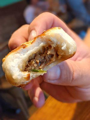 Inside of pan fried buns | IG: asianadventuretime