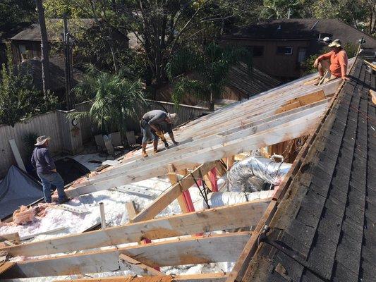 Replacing damaged rafters on roof replacement in West Houston.