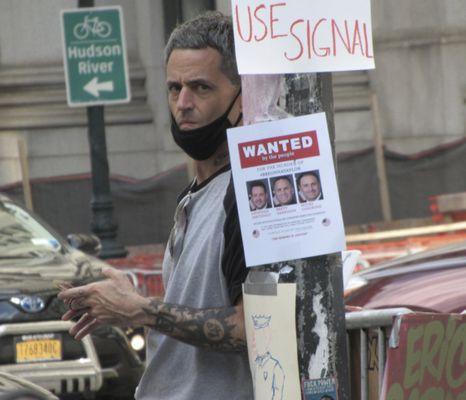 I attended a rally at City Hall Park & this man stalked me around the park to, I guess, SURVEIL me. I got this photo of him staring me down.