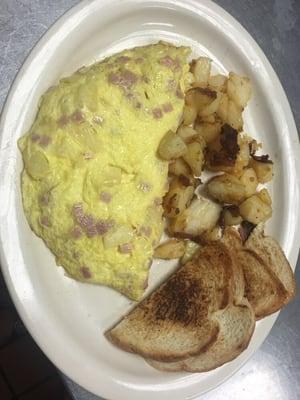 Hawaiian omelette served with home fries and toast