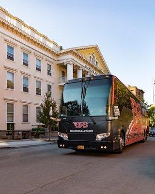 A Big Red Bullet Bus in Downtown Ithaca