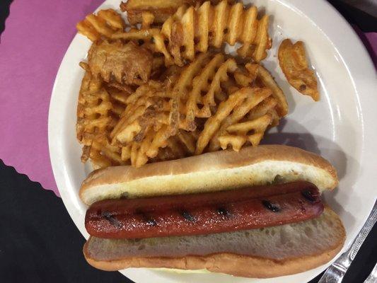 Hot dog and waffle fries. Condiments served on the side.